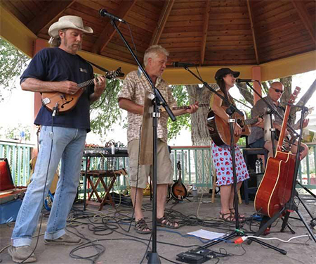 Local four-piece band playing mandolins, acoustic guitar, and bass